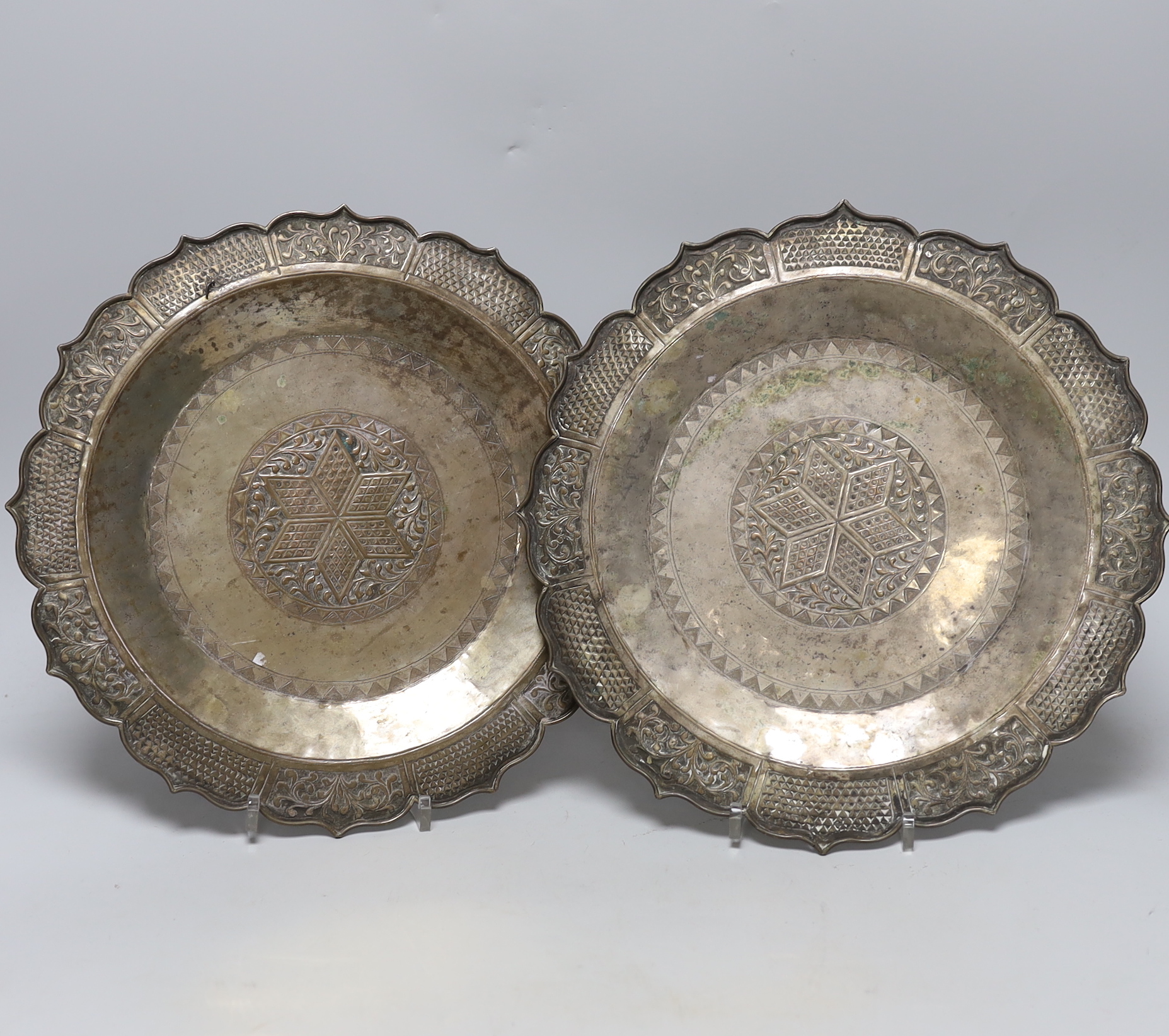 Two Asian base metal plates, 29.5cm diameter